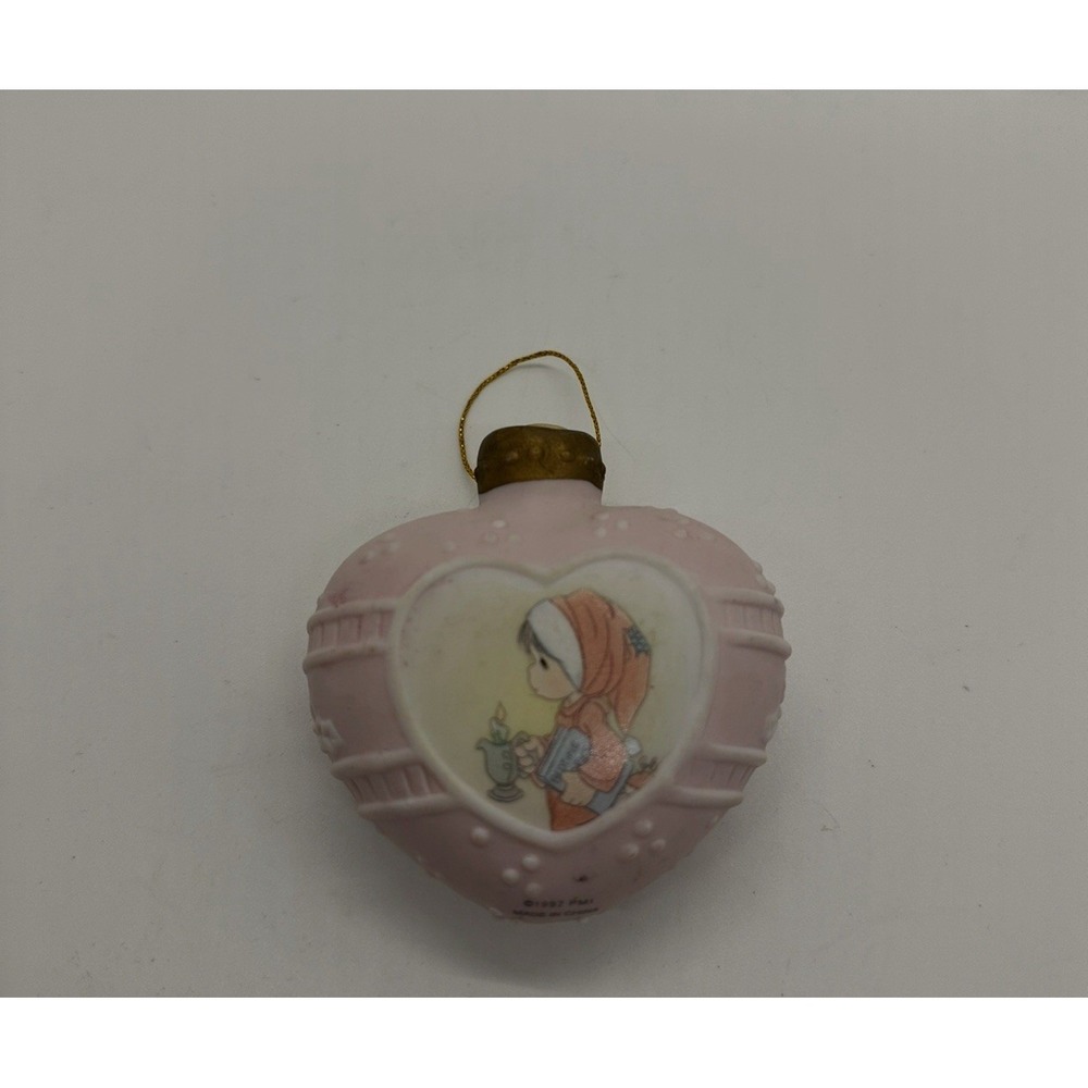 1997 Precious Moments Merry Christmas ornament.